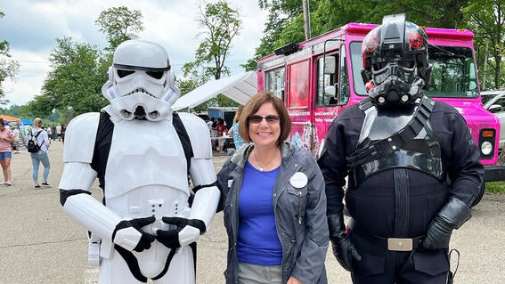 Costumed characters with Make-A-Wish Development Director, Stephanie Pugliese