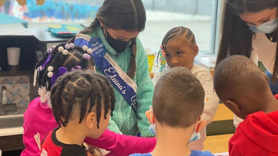 Elaina delivers toys to kids