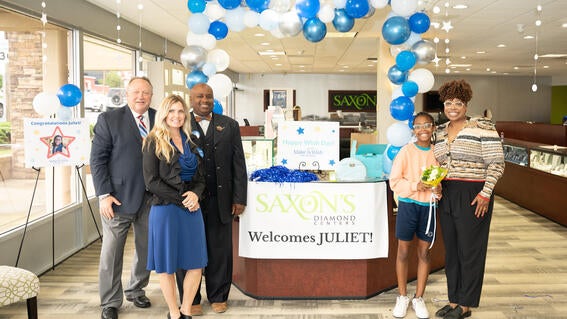 Juliet with Saxon's employees