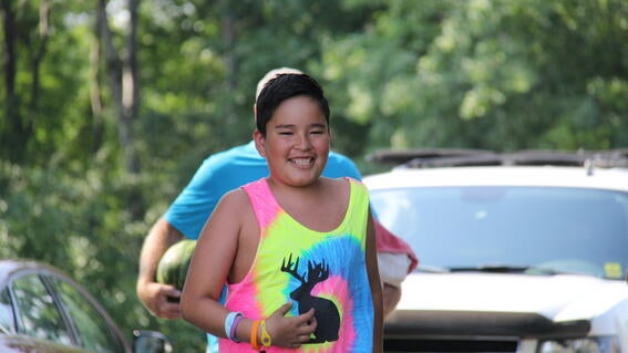 Nico running to his kayak 