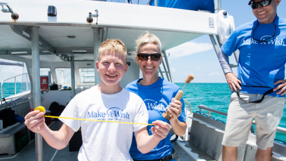 Wish Kid Cole with shark measurement