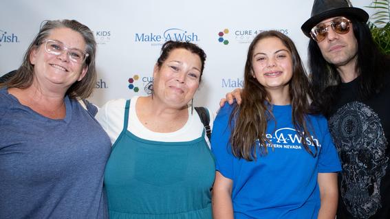 Wish kid Adison poses for a memorable photo with her mom, aunt, and Criss Angel.