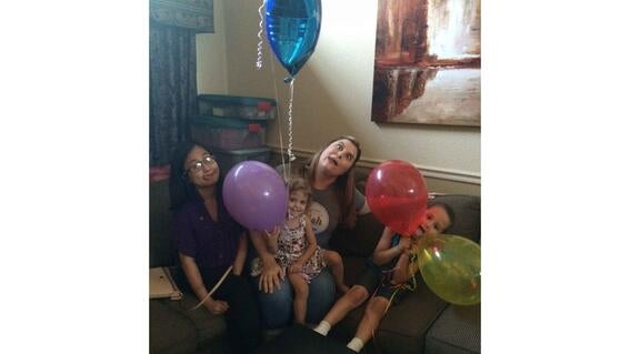 Vincis, Erin, wish kid Gianna on Erin's lap, and Aria's brother