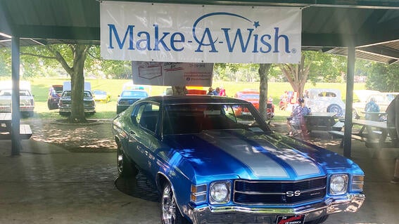 A show car at the entry way for Wheels for Dreams.