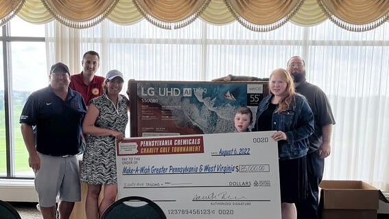 A $85,000, presented to wish kid Jackson and his parents Jade and Dennis.