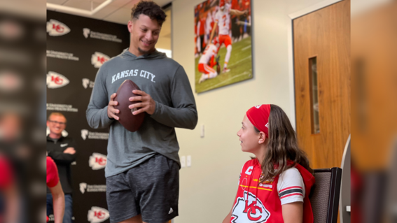 Myka sitting down with Patrick Mahomes