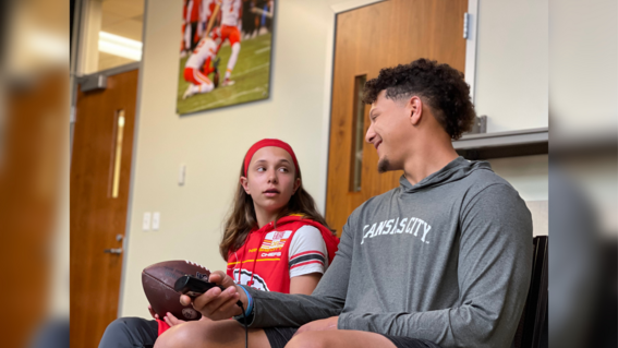 Myka and Patrick Mahomes watching film