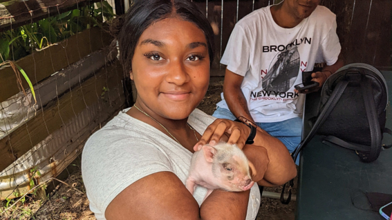 Bryanna holding a pig