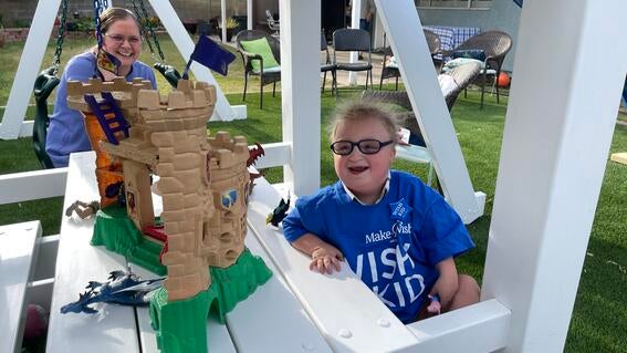 Wesley under his playset.