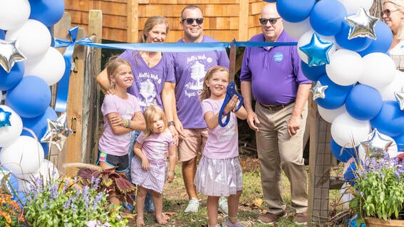 Kalli cutting her ribbon