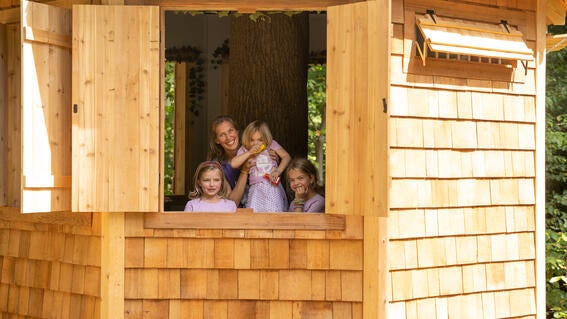 Kalli and her sisters in the treehouse