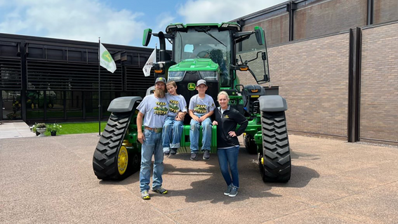 Westyn and his family on tractor.