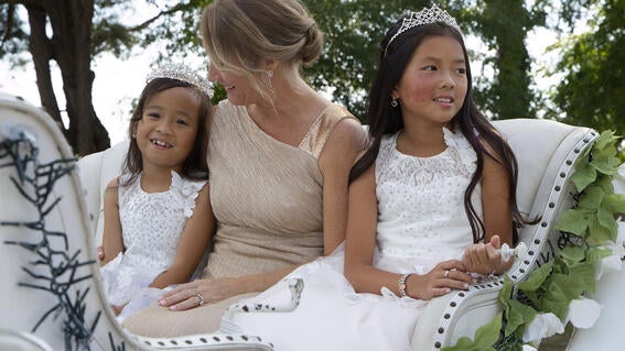 Journi, her mom, and her sister enjoying their carriage ride