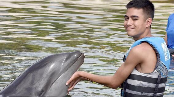 TXGF- Kekoa with dolphin