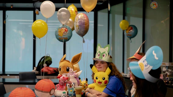 Selah with pokemon stuffed animals and baloons