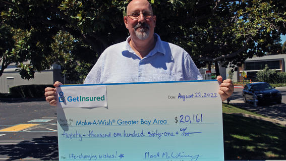 Mark McWhinney with big check for Make-A-Wish Greater Bay Area