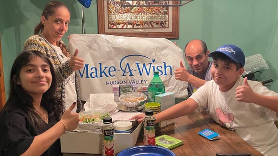 Mateo and his family celebrating his wish