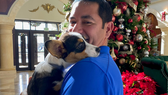 Volunteer Edwin Reina with puppy