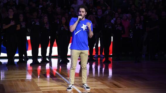 Wish Community member singing the national anthem at a Boston Celtics game
