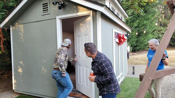 Billy opening shed door