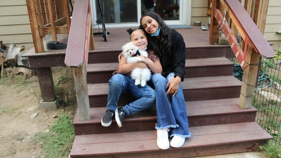 Cienna and sister holding prince.