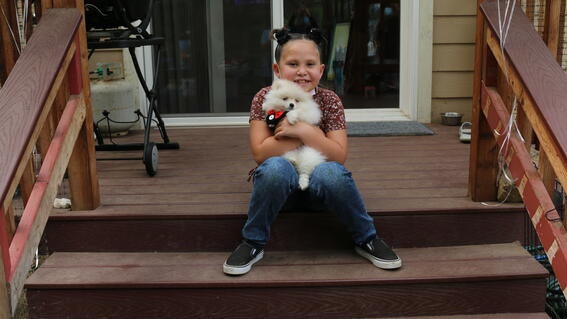 Cienna holding puppy