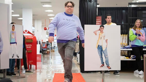 Wish alum modeling Vivek's design