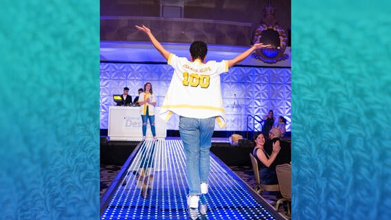 Wish alum Ella walks the runway at gala