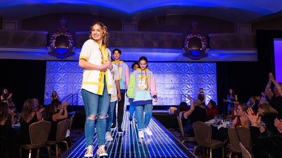 Wish alum Amy walks the runway at gala