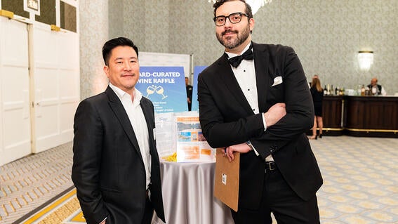 Harrison Wong and Nick Centis at a raffle table
