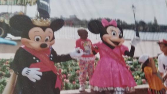 child with mickie and minnie mouse
