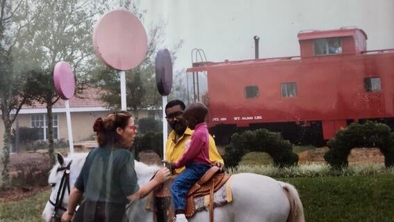 Child riding pony