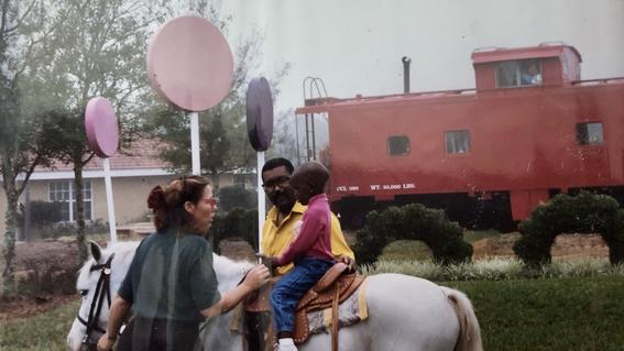 Child riding pony
