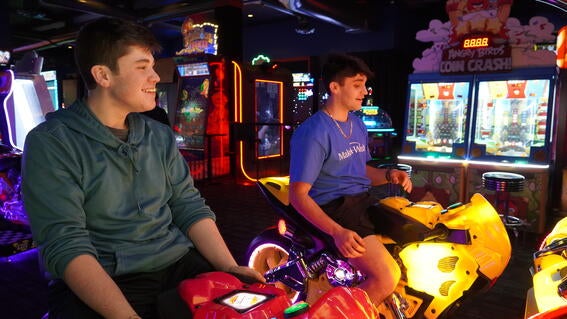 wish kid playing at Dave & Buster's