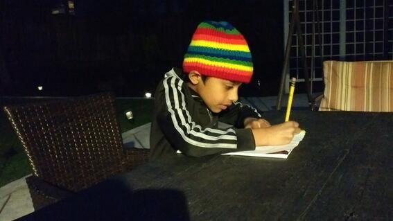 Nirav writing his comic