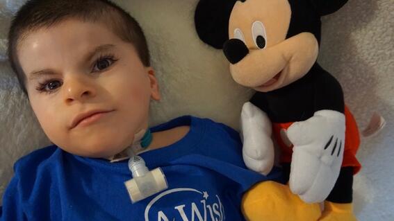 wish kid jameson with mickey doll