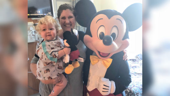 Wish kid Quinn with Mickey Mouse - OCIE