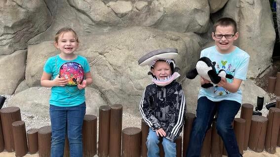 Brayden and siblings smile during wish trip