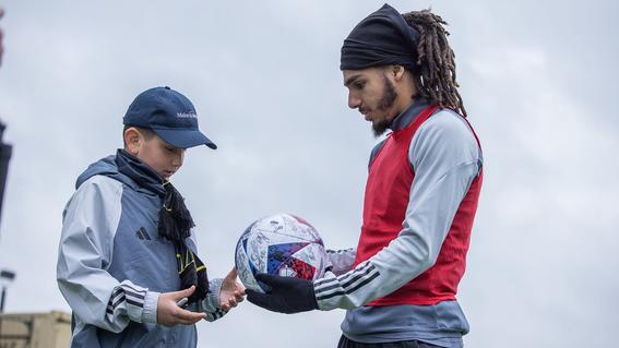 Santiago with signed soccer ball