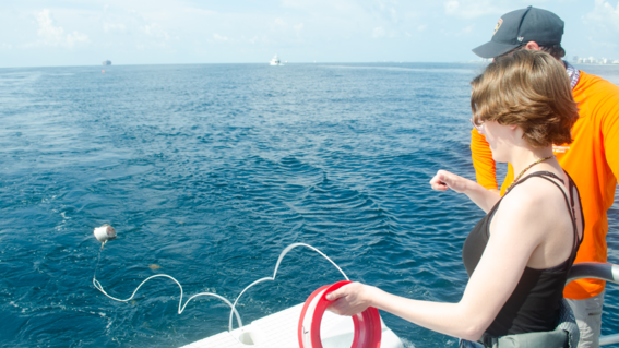 Emily learns to throw a line on the research boat