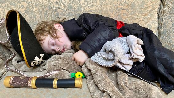 James asleep in his pirate outfit