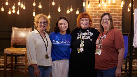 Amelia with staff from An Unlikely Story at her book launch party