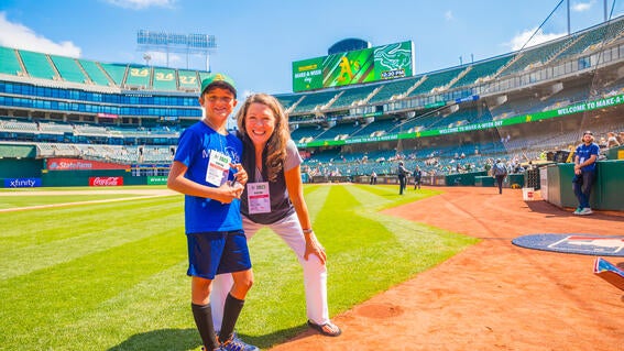 Wish kid Becket with CEO Betsy Biern