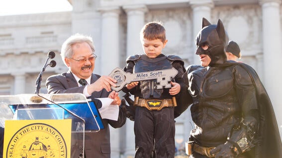 Batkid receiving the key at the San Franisco City Hall