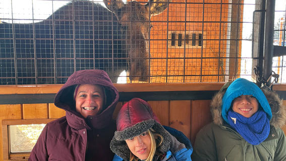 Yuval and family with moose