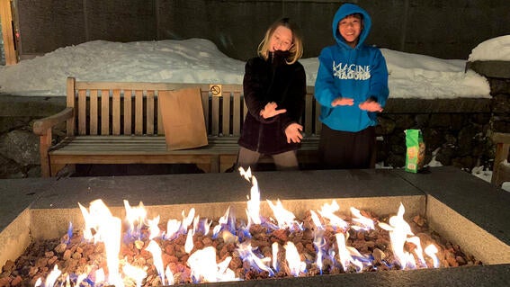 Yuval and friend at fire pit