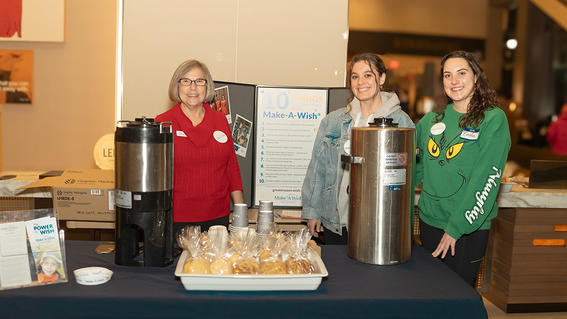 Make-A-Wish Director of Development Stephanie Pugliese with Make-A-Wish volunteers ready to sell hot chocolate. 