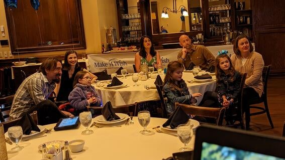 Marcy and her family watching the premier of her wish story at Maggiano's
