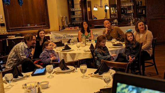 Marcy and her family watching the premier of her wish story at Maggiano's