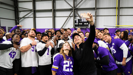 Sylvia snaps a selfie with the Minnesota Vikings and Coach O'Connell